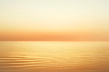 Obraz premium Tranquil landscape featuring a lake shrouded in soft, golden mist at sunrise, creating a serene and peaceful atmosphere