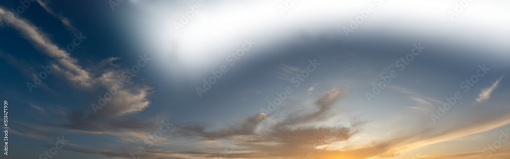 Canvas Prints late day sky as the setting sun colors some clouds with a partially transparent sky