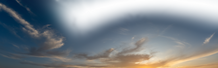 Late day sky as the setting sun colors some clouds with a partially transparent sky
