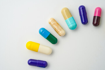 Clock made of pills capsules, pills form a circle, omega, vitamins, Cod liver oil, supplements