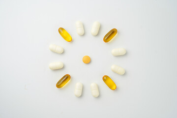 Clock made of pills capsules, pills form a circle, omega, vitamins, Cod liver oil, supplements