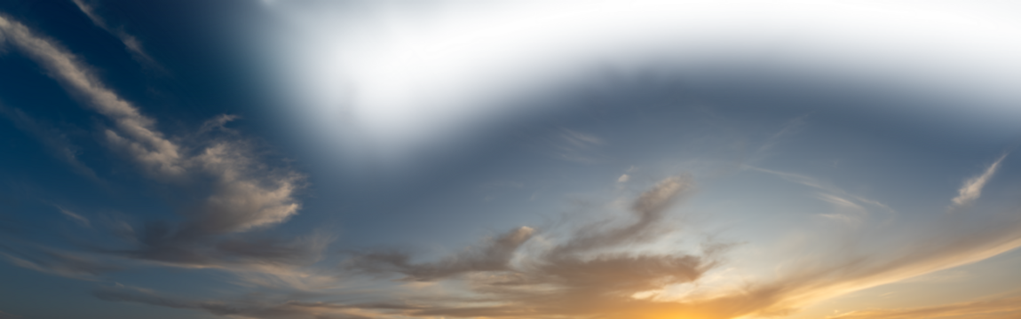 Late day sky as the setting sun colors some clouds with a partially transparent sky
