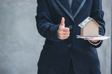 Real estate agent hands holding home business mortgage loan investment property. Hands saving...