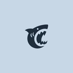 Shark bite logo in fierce and dynamic silhouette illustration.