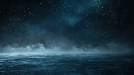 A dark, starry sky with a misty ocean in the foreground.