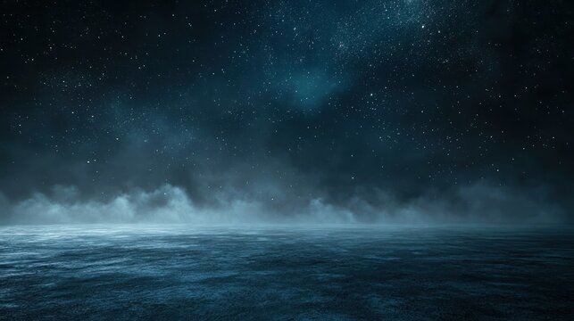 A dark, starry sky with a misty ocean in the foreground.