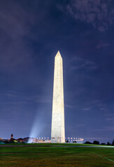 Dramatic nighttime view of the Washington Monument in Washington, D.C., USA, its towering marble...