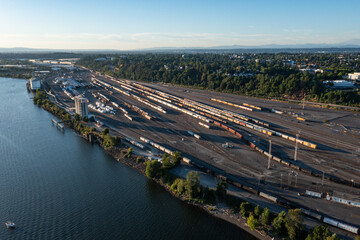 Aerial drone picture of Portland’s industrial district near Willamette river, at sunset, showing...