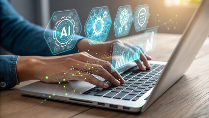 Person using laptop with holographic ai and data analytics interface overlay