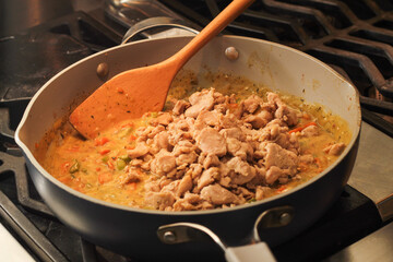 Close-Up of Homemade Chicken Pot Pie Being Prepared with Simple Ingredients