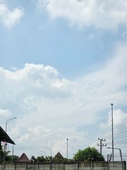 view of bright blue sky and white clouds in the countryside