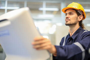 Team of engineers at conference project meeting room, discuss and inspect robot AI mechanism, find solutions, use laptop at industrial technology factory. High-Tech Science and Engineering Concept.