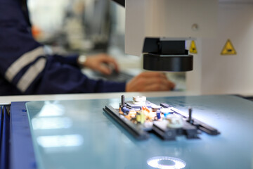 Team of engineers at conference project meeting room, discuss and inspect robot AI mechanism, find...