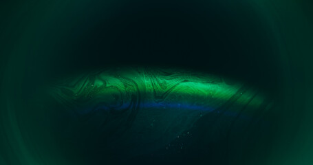 Neon light. Color flow paint. Defocused green blue vibrant texture circling cloud glitter rainbow...
