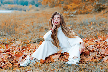 Autumn girl in good mood posing outdoor. Dreamy girl in fall. Beauty model, young beautiful woman...