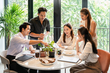 Group of Young Business People on Break in Office. Successful Business Team Talking on Coffee Break. Young Smiling Colleagues on Break Drinking Coffee Chatting in Modern Office. Corporate Lifestyle.