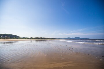 Tranquil Beach Walk Under Clear Skies, Sabah, Malaysia