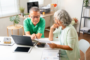 Senior couple with laptop for life insurance documents, home retirement planning or investment with...