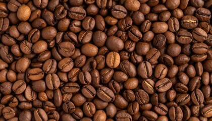 Obraz premium Roasted coffee beans close-up, rich brown tones and textured surface, aromatic background