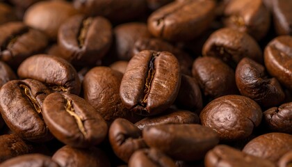 Fototapeta premium Roasted coffee beans close-up, showcasing rich textures and warm, inviting aroma