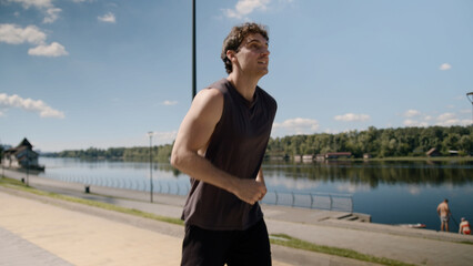 Happy excited energetic Caucasian man runner run jogger smile successful sport male enjoy open arms...