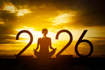 Woman Meditating for a Peaceful 2026 at Sunset
