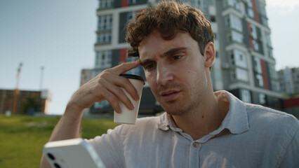 Frustrated Caucasian man reading bad news mobile phone smartphone cellphone male businessman...