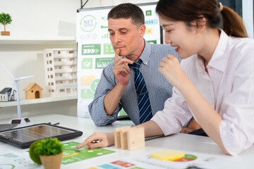 Businesspeople talk ESG strategies global warming, green finance and investment and net zero waste lifestyle.