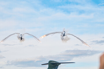 Military Helicopters Releasing Flares in Defensive Maneuver