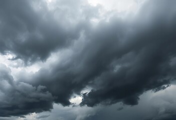 Obraz premium Ominous, swirling dark grey and black storm clouds fill the frame, thunderclouds, cloud formation