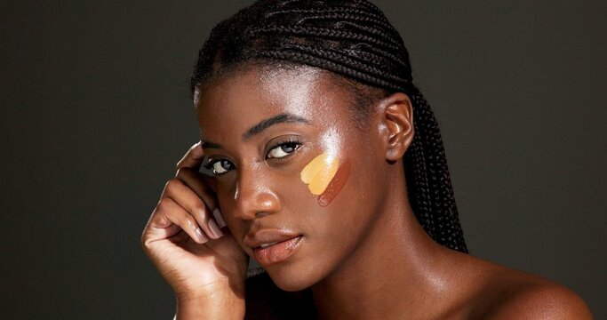 Black woman, portrait and beauty makeup with shade in studio for foundation on a dark background. Female person, African model or color stripes with cosmetics for skin tone, glow up or shine on space