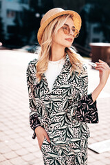 Young beautiful smiling blond hipster woman in trendy summer hippie costume clothes. Carefree...