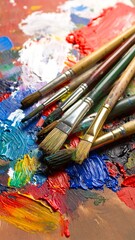 Fototapeta premium Paintbrushes on a vibrant artist's palette (1)