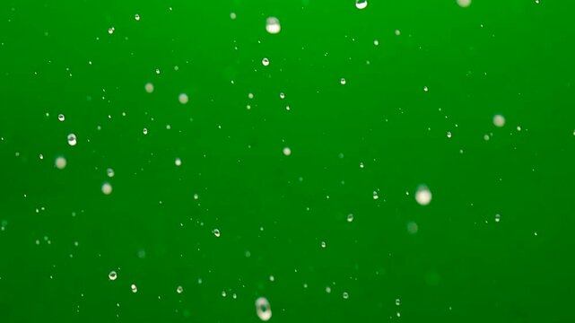 splashing water drops, water splash isolated on green screen background. perfect for compositing fresh, perfect for nature, energy, purity, refreshment, visual effects, and transparent fluid motion