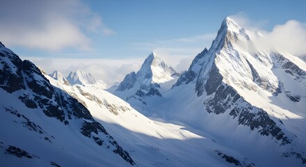 Fototapeta premium Majestic snow-covered alpine mountain peaks with rugged ridges, pristine snow, dramatic sunlight, and a vibrant blue sky creating a breathtaking and serene high-altitude landscape