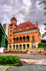 View of Richmond Main Street Station featuring its striking clock tower, red brick facade and ornate Second Renaissance Revival architecture. Virginia, United States