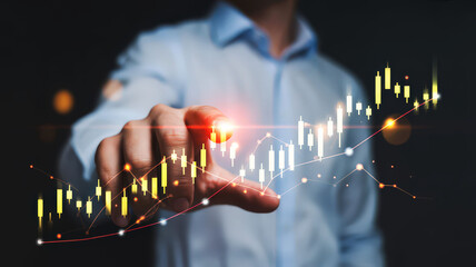 Man pointing at a stock market chart with candlestick pattern and upward trending line graph overlayed