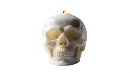 A white skullshaped candle with a burning flame, isolated on a white background