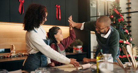 Christmas, baking and family with girl, high five and bonding together with support, home and festive. African parents, mother or father with daughter, Xmas or tradition with ingredients or gesture