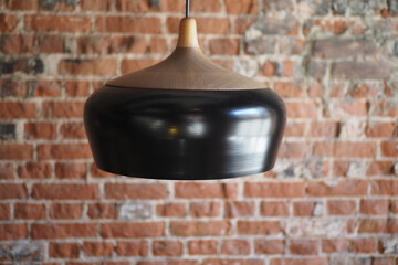 Modern wooden and metal pendant light in cozy interior space