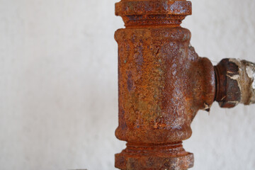 Rusty pipe fitting showing signs of age and wear