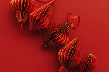 Festive Red Paper Christmas Ornaments, hanging red flashlight or lantern in row, honeycomb...