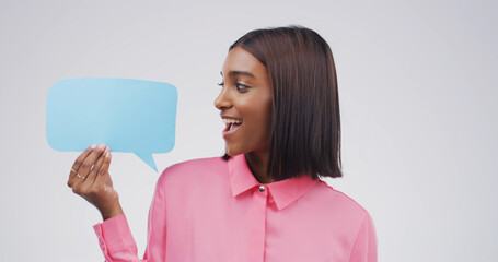 Excited, speech bubble or woman in studio, feedback or information sign on white background. Decision, person or social media with poster, surprise and opinion with voice review and announcement