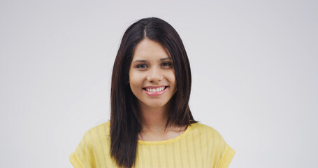 Portrait, confident and woman with smile, studio or happy for opportunity in college or scholarship. White background, student or person with pride for knowledge, education or creative writing course