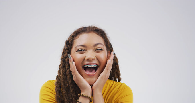 Shock, portrait and scream with woman in studio for winner, scholarship or deans list announcement. Surprise, academic merit and student reward with person on white background for wow, space or bonus