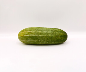 Fresh Organic Cucumbers Isolated on White Background. Group of Green Cucumbers on Clean White Surface. Healthy Green Cucumbers for Diet and Nutrition Design. Top View high resolution image.