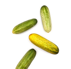 Fresh Organic Cucumbers Isolated on White Background. Group of Green Cucumbers on Clean White Surface. Healthy Green Cucumbers for Diet and Nutrition Design. Top View high resolution image.