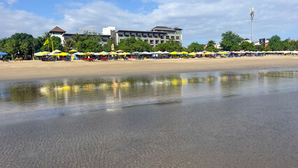 Beach holiday scene at Legian Beach in Bali