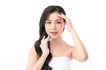 A beautiful young Asian woman with clean, fresh skin against a white background. Skincare, facial...