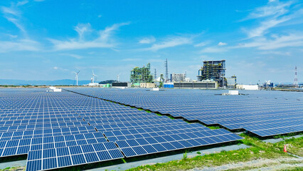 Aerial view of biomass power plant and wind and solar power plant